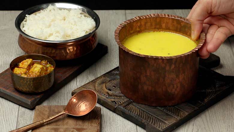 Serve Besan Kadhi with rice and eat hot