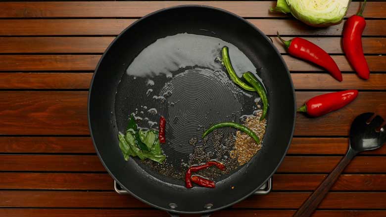 Add spices and curry leaves for the tempering - Cabbage and Carrot Foogath recipe