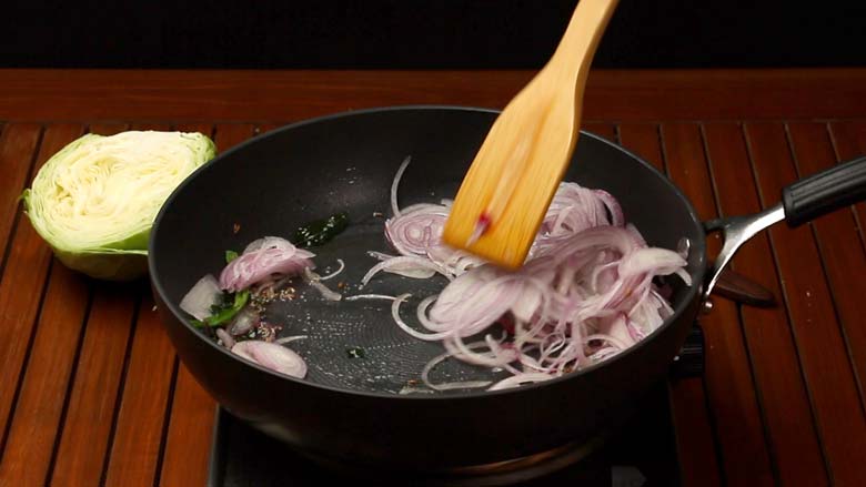 Saute onions till softened - Cabbage and Carrot Foogath recipe