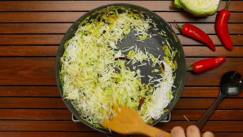 Cook cabbage and coconut for a few minutes - Cabbage and Carrot Foogath recipe
