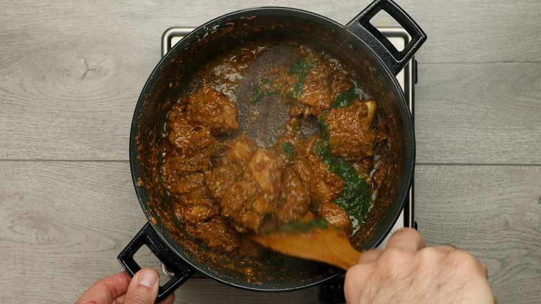 Add green chutney masala to browned mutton and stir - Hyderabadi Mutton Korma recipe