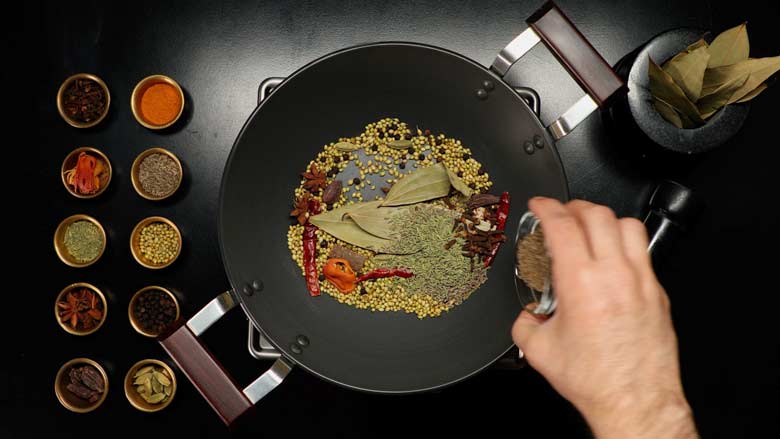 Add caraway seeds - shahi jeera - and continue to dry roast spices - Biryani Masala Powder Recipe