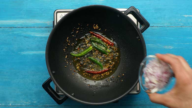  Fry the panch phoron and chillies before adding onion - Potato Mushroom Posto recipe