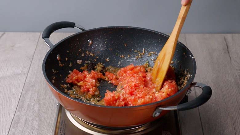 Tip in chopped tomato and stir - Keema Pav Recipe
