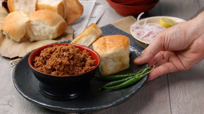 Garnish keema with fresh coriander leaves - Keema Pav Recipe