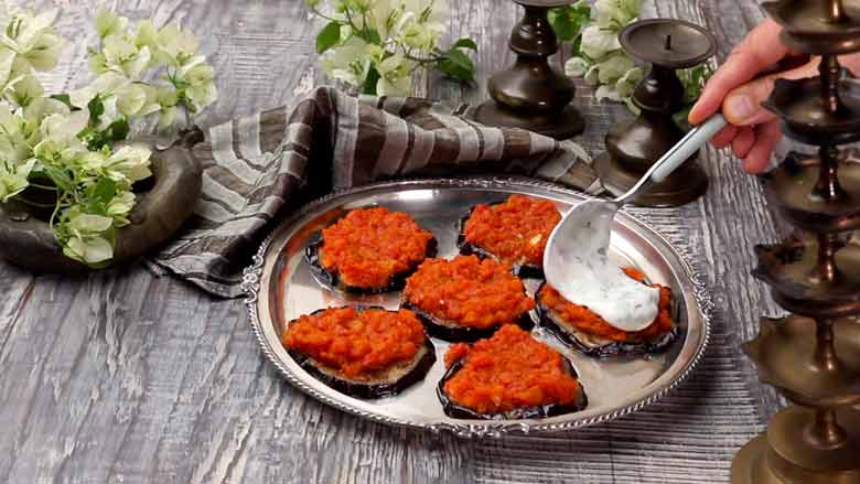 Top each slice with a generous dollop of yogurt sauce and serve immediately - Badal Jaam Recipe