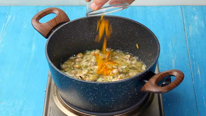Add orange rind to the spices and nuts - Zarda Pulao Recipe