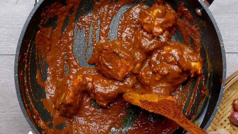 Add chicken and dark and light soy sauces along with palm sugar. Stir before adding coconut milk - Khao Soi Recipe - Chiang Mai Curried Noodles