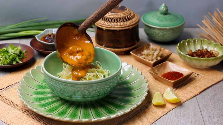 Assemble khao soi: place egg noodles in a bowl and top with khao soi curry. Follow by adding all other garnishes as desired - Khao Soi - Chiang Mai Curried Noodles