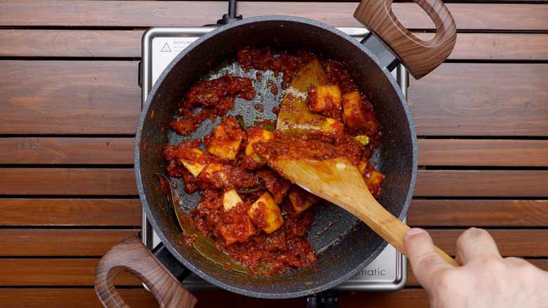 Add tomato, cook till oil leaves the masala, then add potato and cook for about 2 minutes - Corn Biryani Recipe