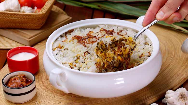 cut through all layers to serve corn biryani accompanied with plain yogurt or preferably raita- Corn Biryani Recipe Sweet Corn Rice