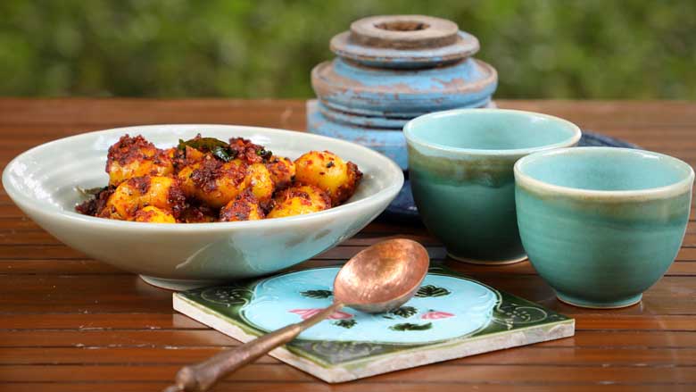 Serve Chettinad small potato masala poriyal with a sambar and kootu to balance the heat - Masala Baby Potatoes Recipe