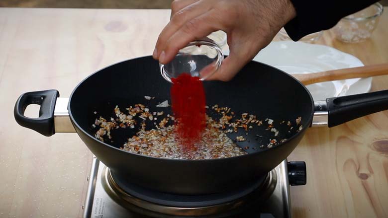 Toss in red chilli powder - Masala Baby Potatoes Recipe