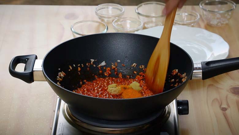 Toss in turmeric powder and quickly stir - Masala Baby Potatoes Recipe