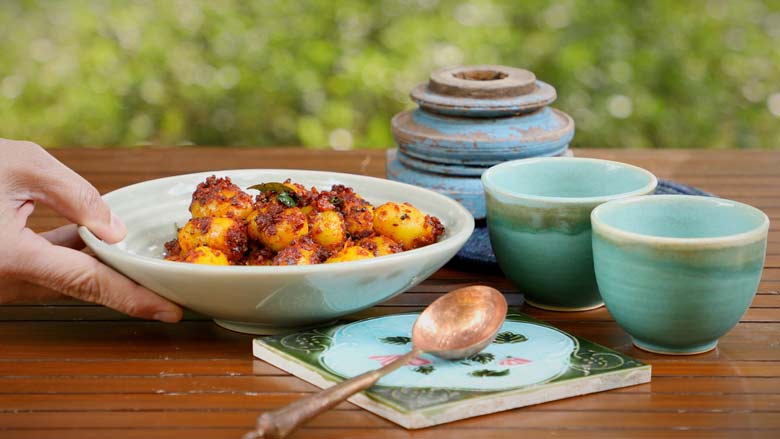 This spicy baby potato masala fry can be served as a side dish, or as an appetiser, snack, or starter - Masala Baby Potatoes Recipe