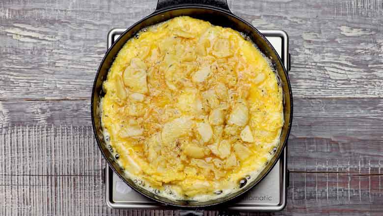  Cook for 6 to 8 minutes till eggs are no longer runny and the eggs in the center have almost set - Spanish Omelette Recipe