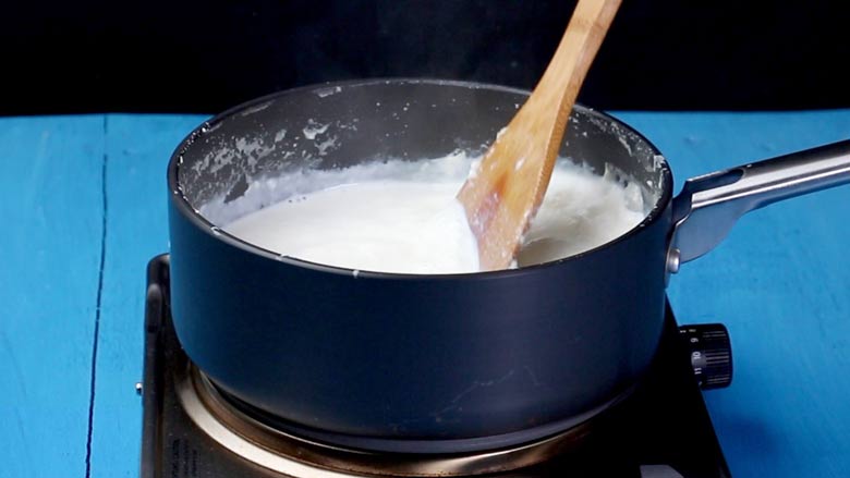 continue cooking till milk is reduced before adding sugar - Mango Kulfi recipe