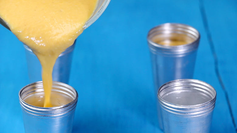 Pour mango kulfi mixture into kulfi moulds leaving about half inch space on top - Mango Kulfi recipe