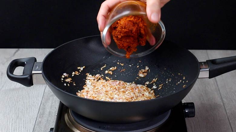 Fry onions till golden brown, then add prepared kori gassi masala paste - Chicken Gassi Recipe - Mangalorean Chicken Curry