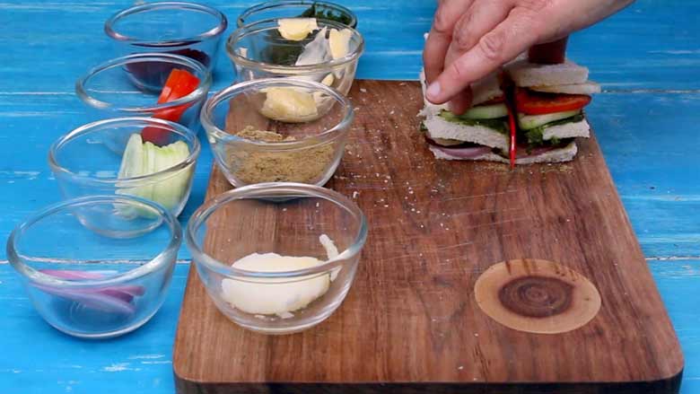 Cut the Bombay veg sandwich in half - Bombay Sandwich Recipe