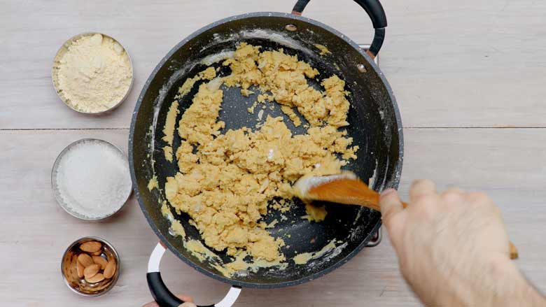 Stir well till sugar is incorporated - Besan Ladoo Recipe