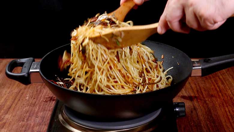 Toss to mix and stir fry noodles for 3 to 4 minutes - Veg Hakka Noodles Recipe