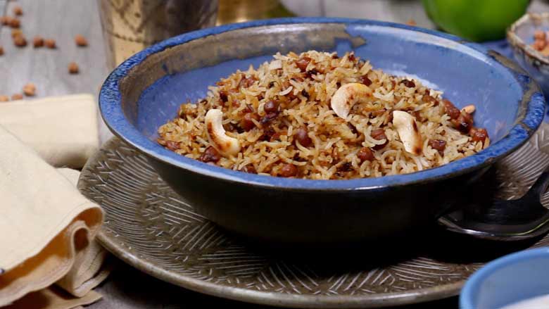 Serve delicious kala chana pulao hot and fresh with any raita of your choice - Kala Chana Pulao Recipe