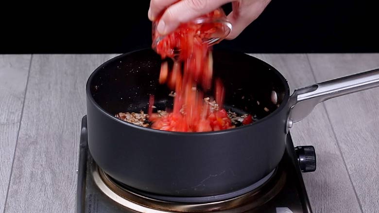 Heat ghee, then add the whole spices, ginger, garlic, green chillies, onion, and tomatoes - Kala Chana Pulao Recipe