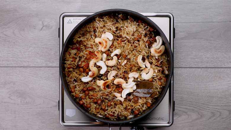 Drizzle on ghee and saffron milk and top with fried or roasted cashew nuts. Cover with a tight-fitting lid and place on dum for 10 to 12 minutes - Kala Chana Pulao Recipe