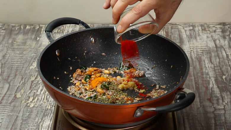 Add fennel seeds (saunf), ginger, turmeric powder, and red chilli powder - Indori Poha Recipe