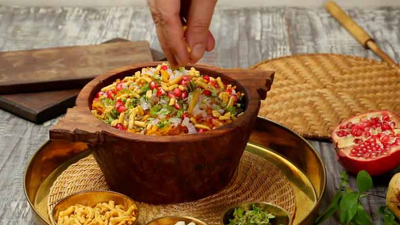 Top with laung sev to taste and serve hot - Indori Poha Recipe