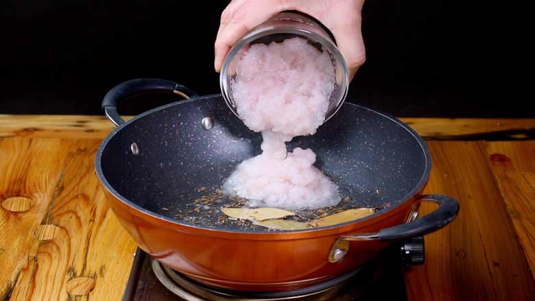 Sauté whole spices till aromatic, then add onion paste, ginger paste, and garlic paste, and cook till golden brown - Aloo Paneer Recipe Video