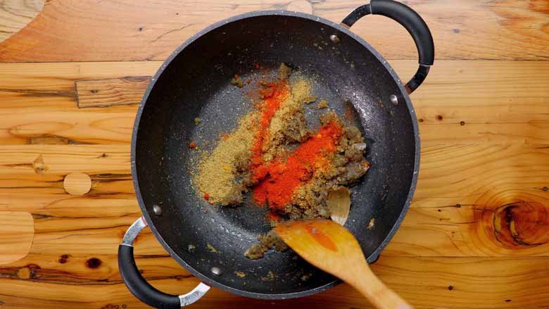 Add turmeric powder, coriander powder, and red chilli powder - Aloo Paneer recipe video