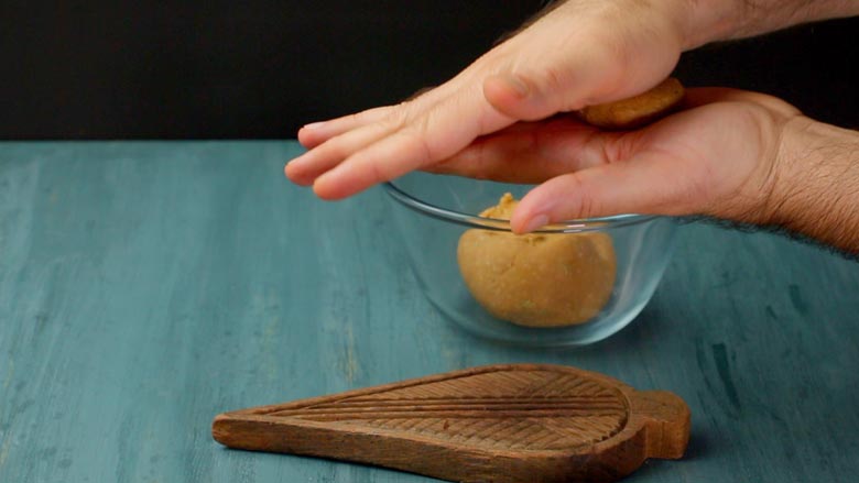 Break of a walnut-sized piece of dough and roll into a ball between your palms - Bihari Thekua Recipe