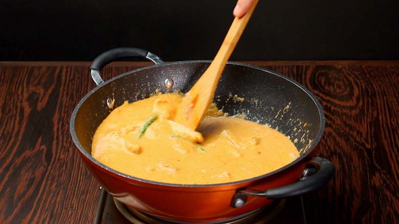 Stir the fish curry very gently, moving your spatula from the outer part of the kadhai / pan inwards carefully - Easy Pomfret Curry Recipe