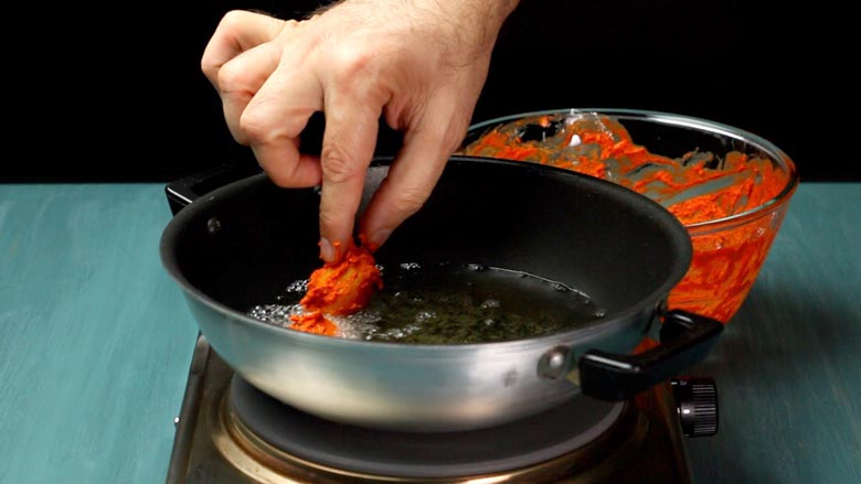 Combine with rice flour and corn flour, then fry in hot oil - Potato 65 Recipe