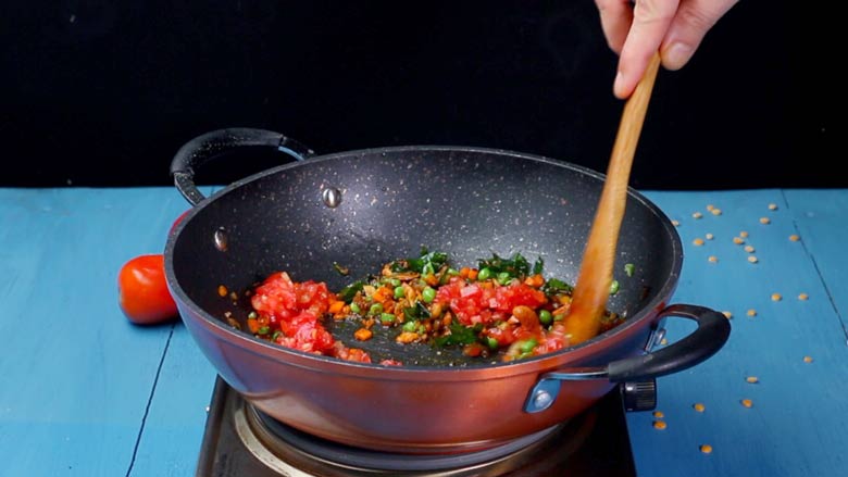 Add green chillies, curry leaves, onion, and ginger.  Slide in peas, carrot, beans. and chopped tomato. Cover and cook for 2 to 3 minutes - Tomato Bath Upma Recipe