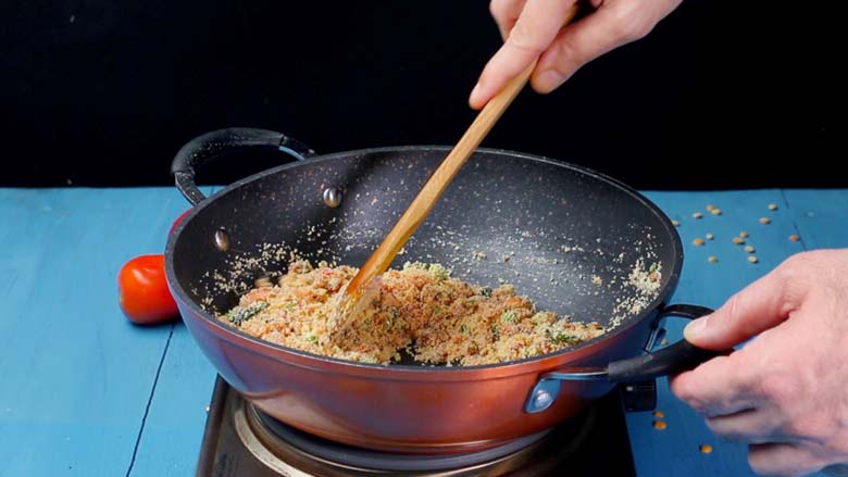 Sprinkle in turmeric powder and salt and stir well - Tomato Bath Upma Recipe