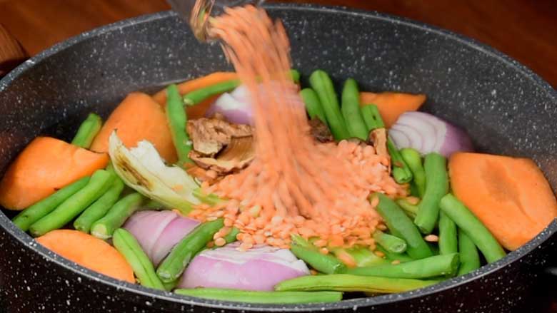 Add cinnamon, dried shiitake mushrooms, and lal masoor dal (split red lentils) to the stock pot - Vegetable Stock Recipe by Yummefy