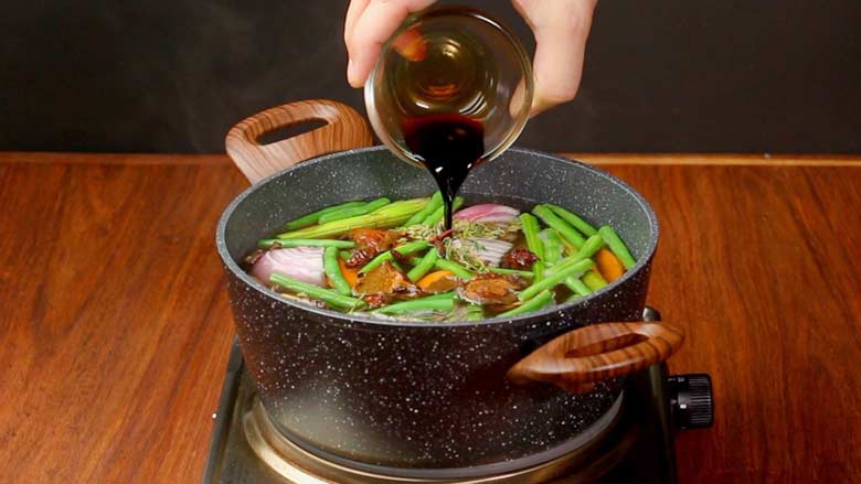 Add rosemary, thyme, black peppercorns, bay leaves (tej patta), cloves (laung), star anise (chakra phool), fennel seeds (saunf), dried ginger powder (sonth), and soy sauce – and stir veg stock well - Vegetable Stock Recipe by Yummefy
