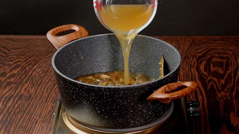 Pour in our homemade vegetable stock, add black pepper and salt - Healthy Mushroom Soup Recipe