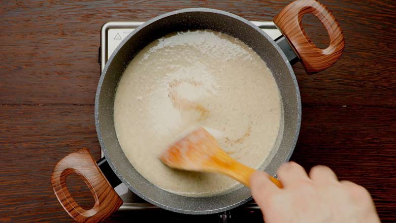 Return blended mushroom soup to the sauce pan, add nutmeg (jaiphal) and simmer for 2 to 3 minutes - Healthy Mushroom Soup Recipe