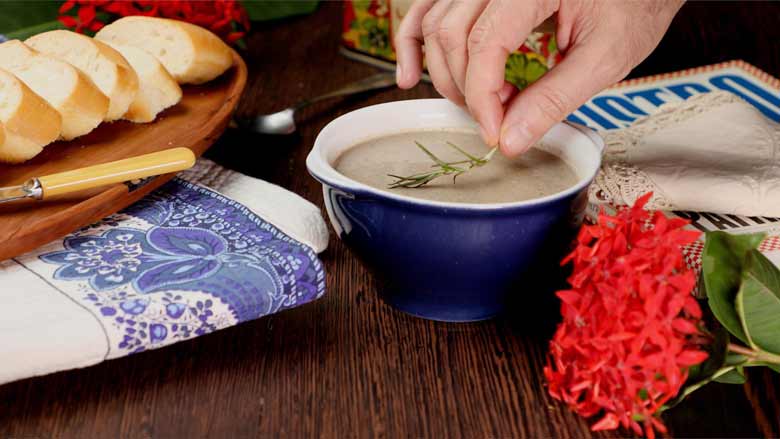 Pour hot mushroom soup into individual bowls, top each with a sprig of rosemary and serve immediately - Cream of Mushroom Soup Recipe
