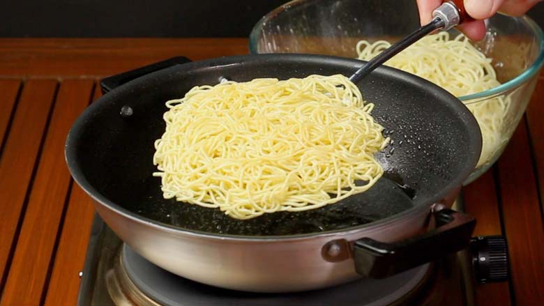 Fry noodles till light golden and crispy. remove from oil and drain - Veg American Chop Suey Recipe