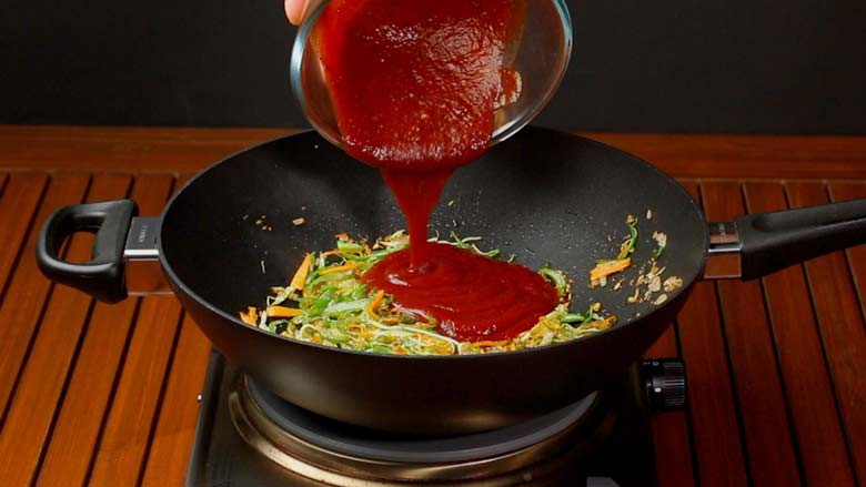 Stir fry ginger, garlic, onion, carrot, capsicum, cabbage, green beans or other vegetables of your choice. Then add prepared sauce - Veg American Chop Suey Recipe