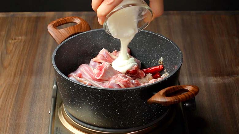 Tip in mutton and yogurt (curd) and stir continuously - Rampur Mutton Stew Recipe