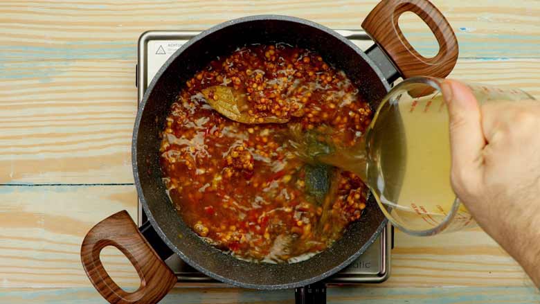 Pour in vegetable stock, bring to a boil, then cover and simmer for 10 minutes - Mulligatawny Soup Recipe