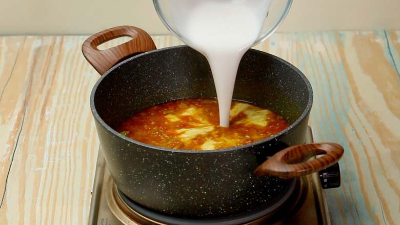 Reduce heat to low and then pour in thick coconut milk - Vegetarian Mulligatawny Soup Recipe