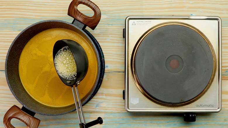 Temper the soup with garlic and red chilli flakes fried in olive oil and butter - Mulligatawny Soup Recipe