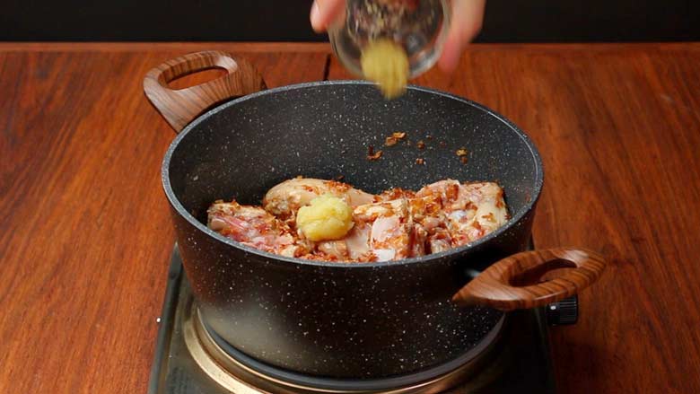 Tip in chicken pieces then add garlic and ginger pastes - Mangalorean Chicken Sukka Recipe